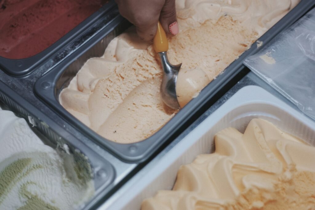 person holding stainless steel spoon